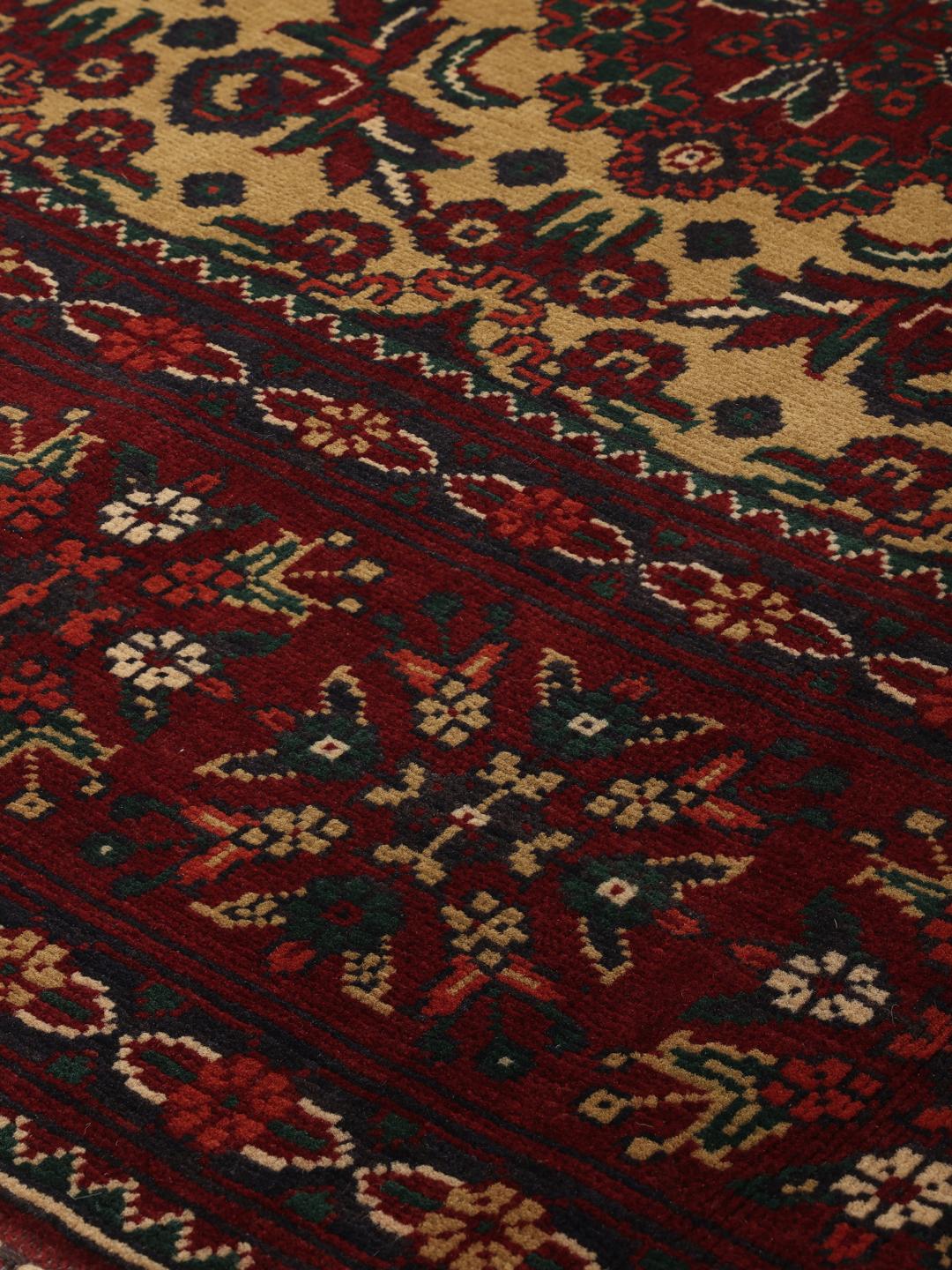Hand-knotted Afghan Kunduz rug in red and yellow