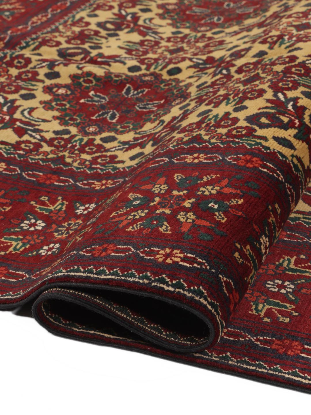 Hand-knotted Afghan Kunduz rug in red and yellow