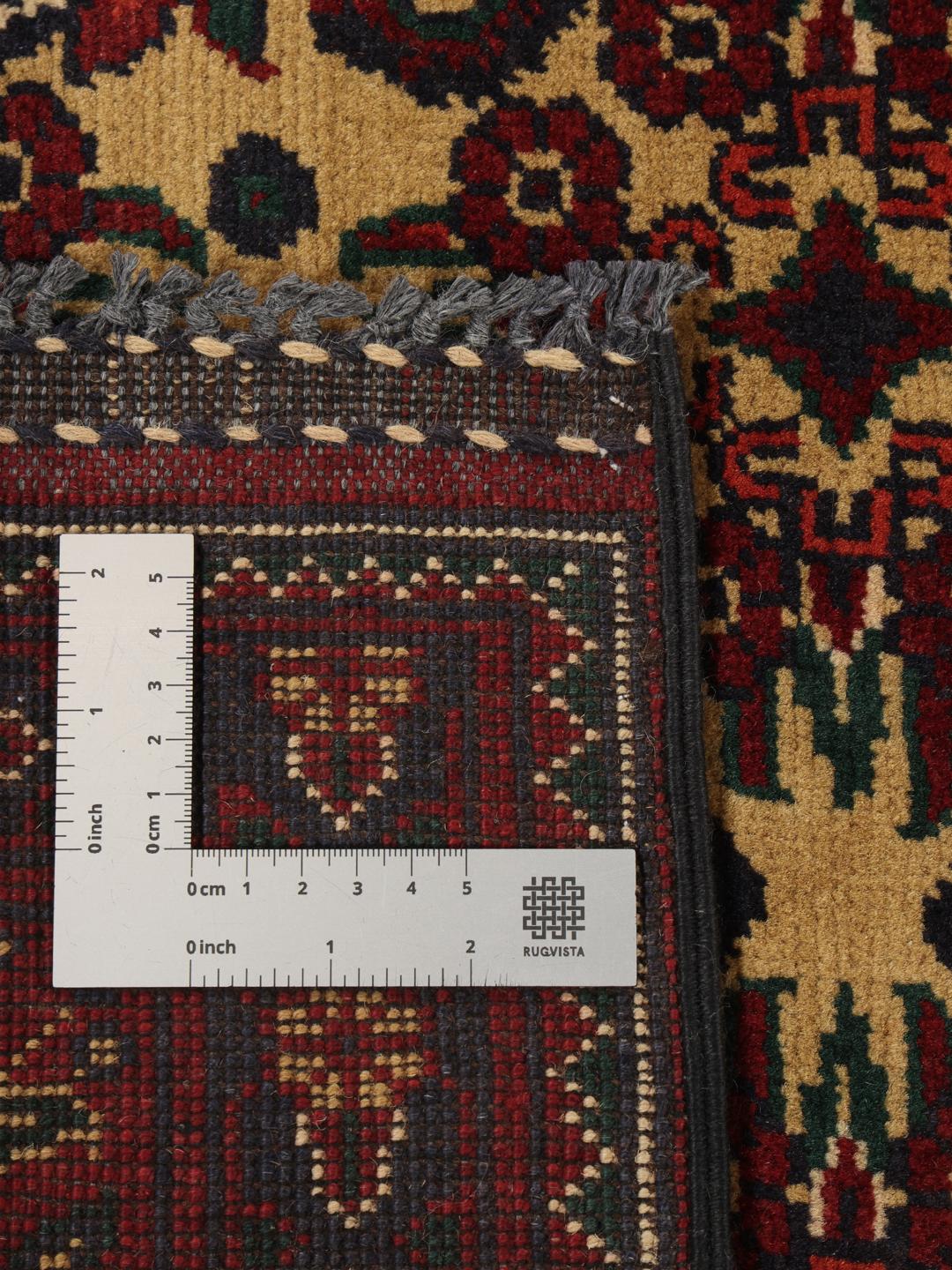 Hand-knotted Afghan Kunduz rug in red and yellow
