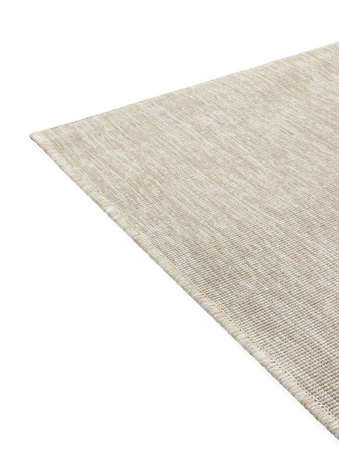 Beige tapijt met een vlakgeweven textuur