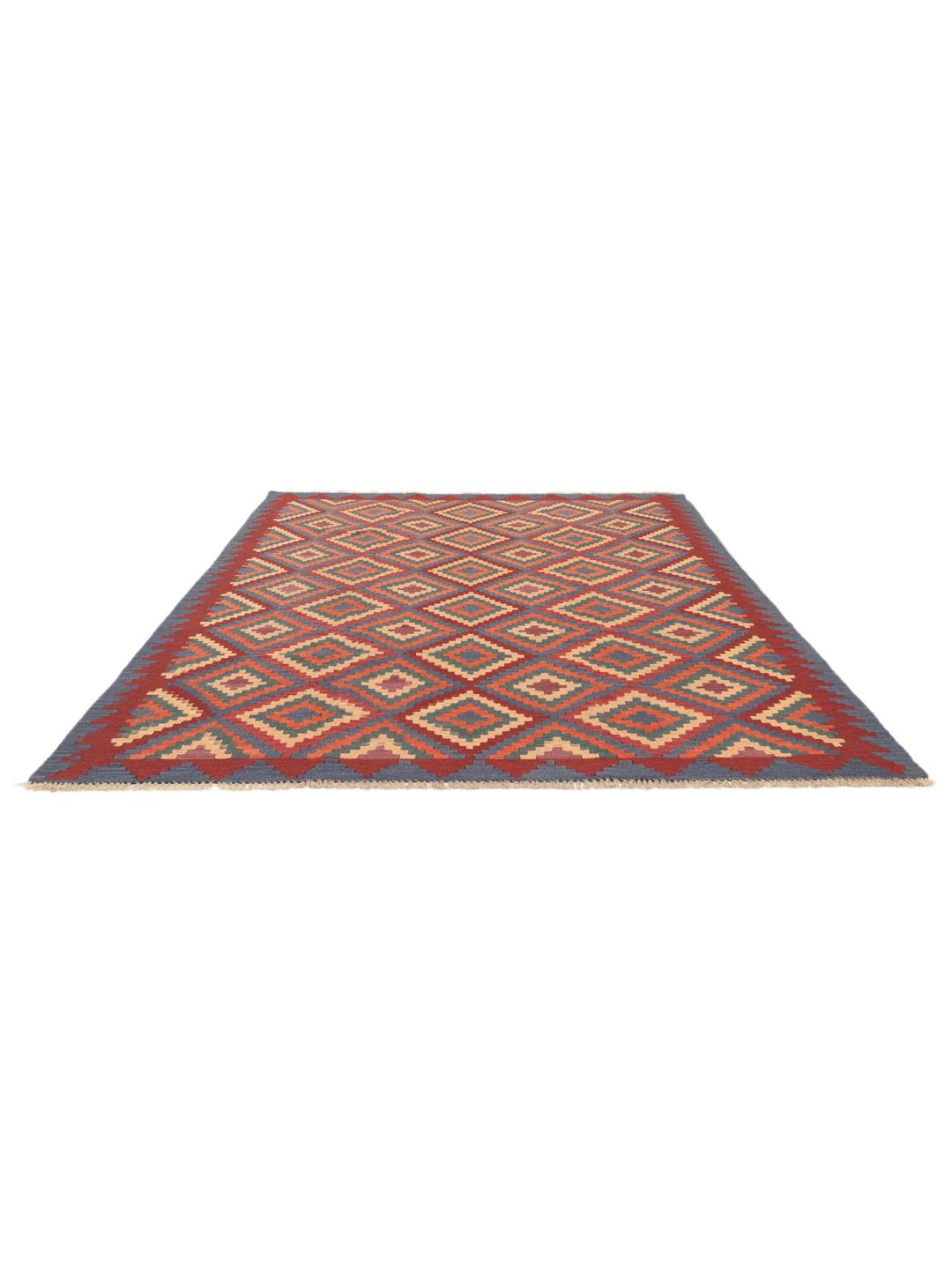 Handgeweven Kelim Ghashghai tapijt met een levendig geometrisch patroon in rood-, blauw- en oranjetinten.