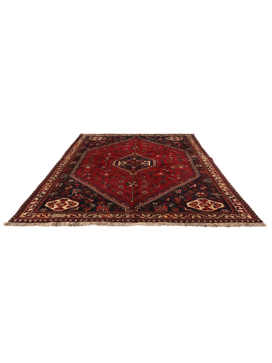 Hand-knotted Middle Eastern tribal rug with red and black geometric patterns