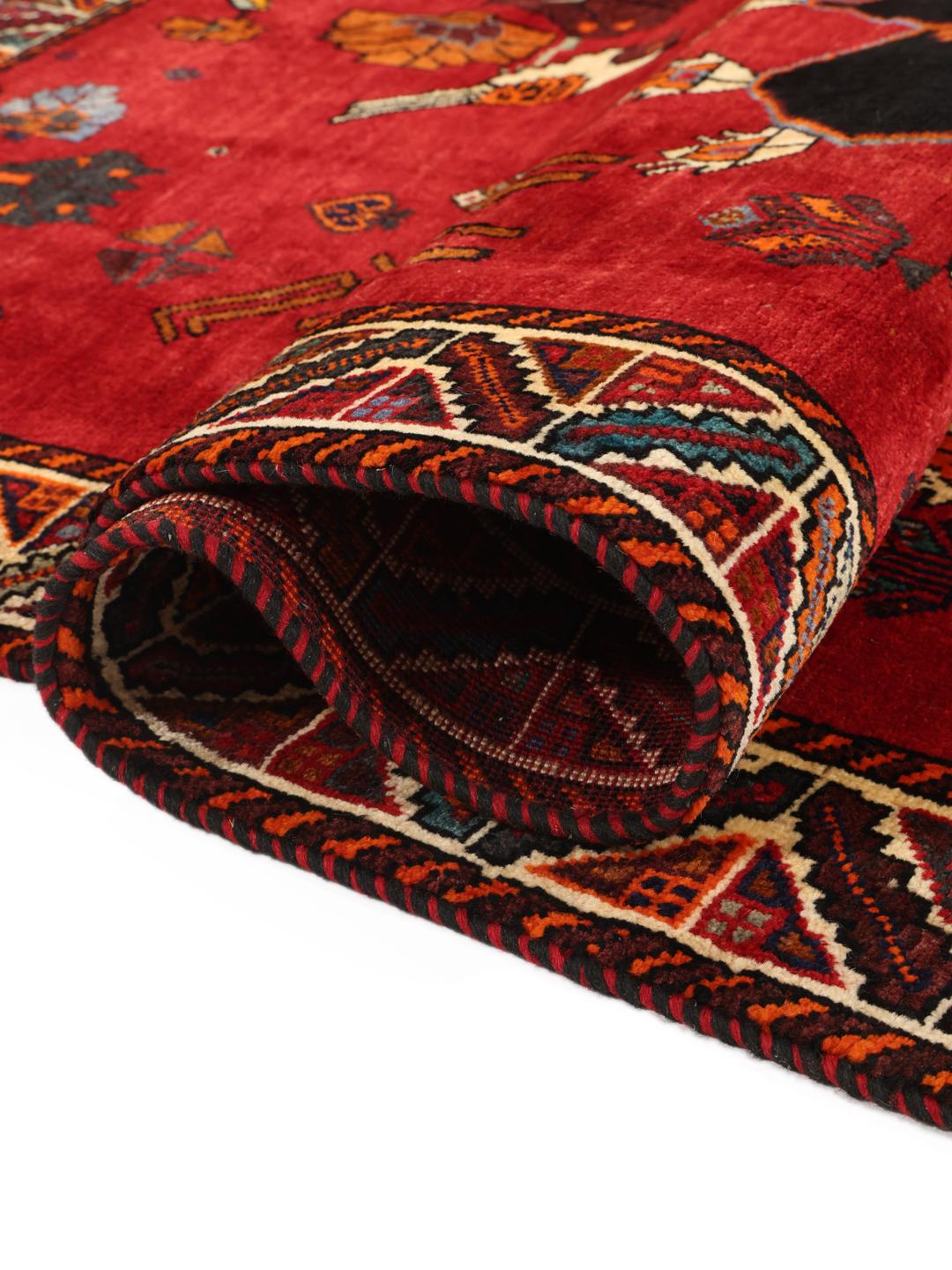 Hand-knotted Middle Eastern Ghashghai rug in red with tribal pictorial motifs