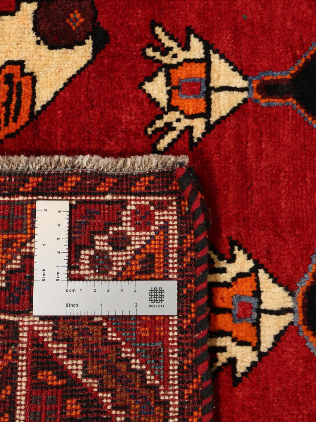 Hand-knotted Middle Eastern Ghashghai rug in red with tribal pictorial motifs