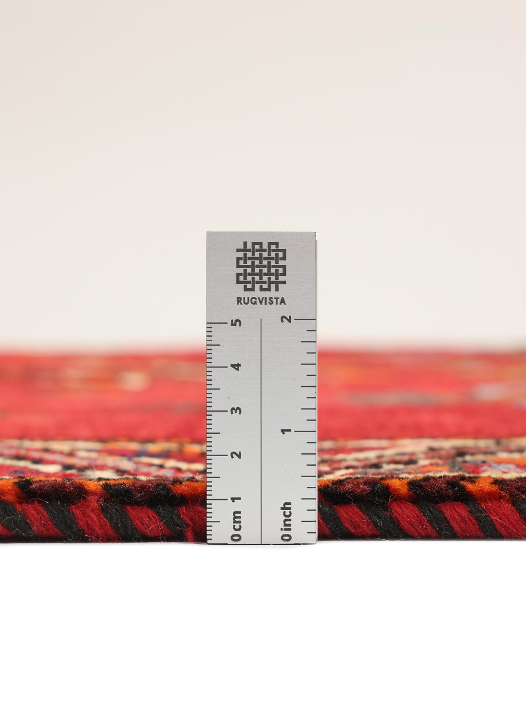 Hand-knotted Middle Eastern Ghashghai rug in red with tribal pictorial motifs