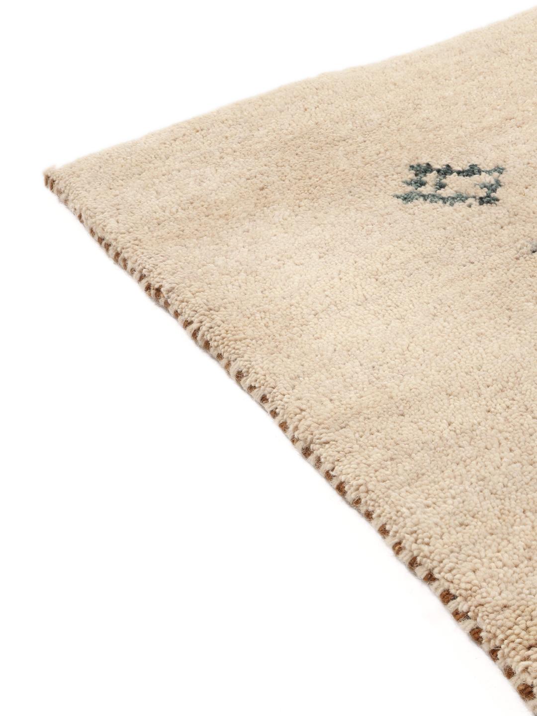 Beige håndknyttet uldløber med fine motiver