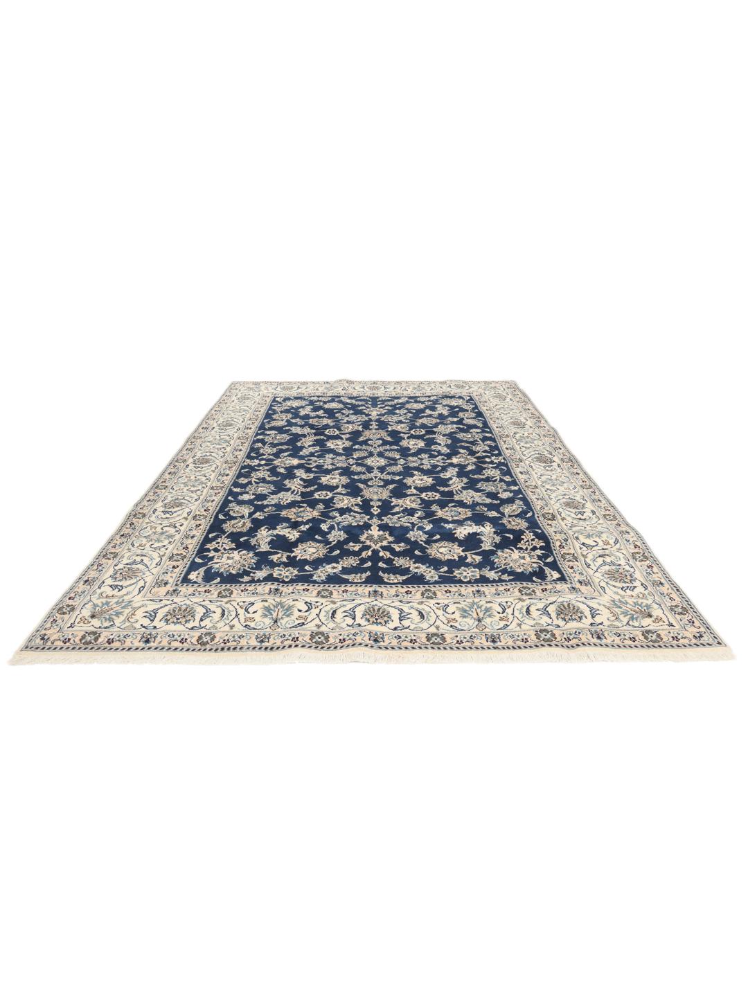 Hand-knotted Nain rug from the Middle East with a deep blue floral pattern