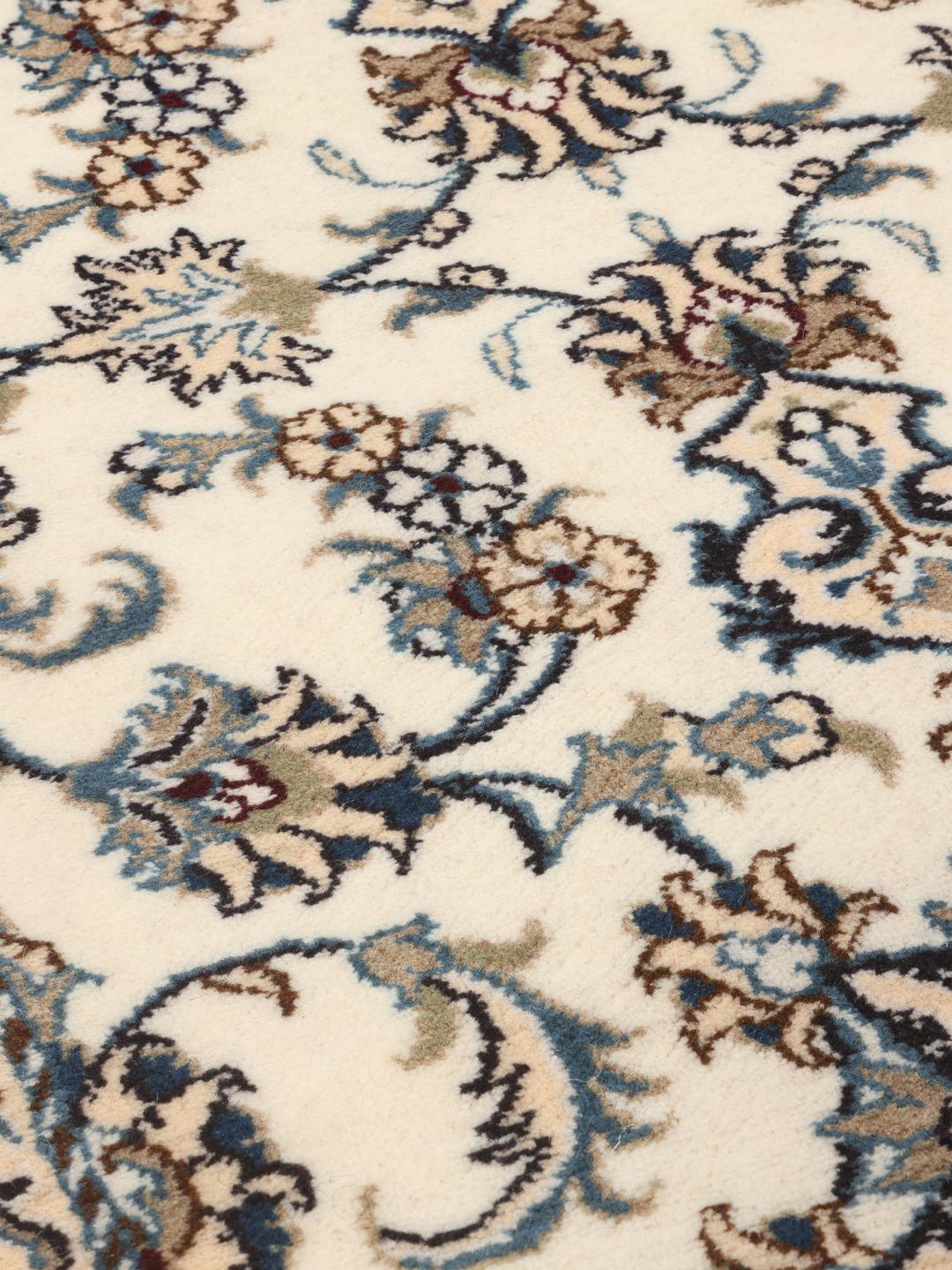 Hand-knotted Nain runner in beige with intricate floral patterns