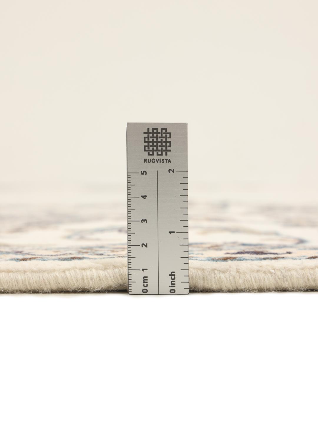 Hand-knotted Nain runner in beige with intricate floral patterns