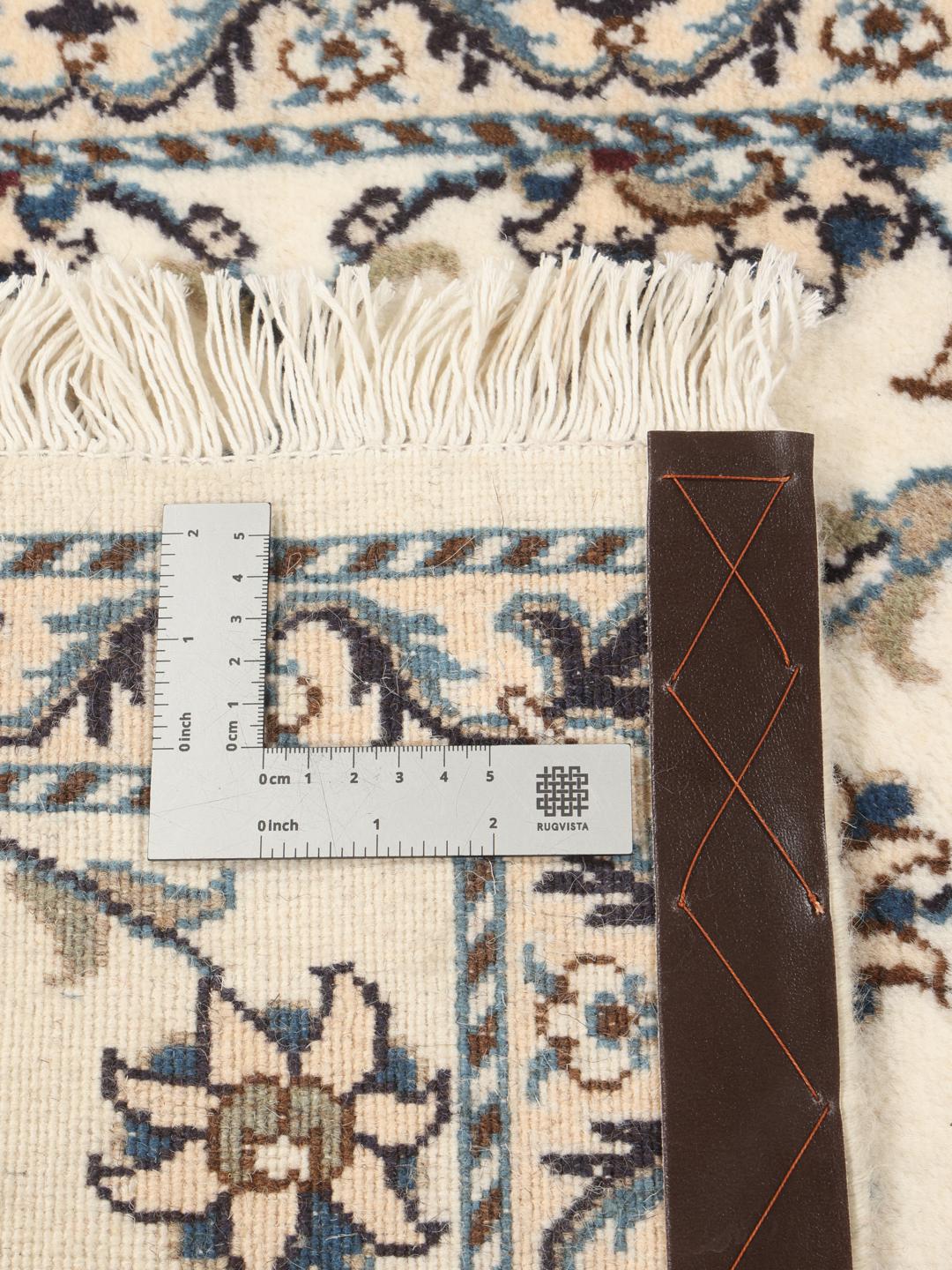 Hand-knotted Nain runner in beige with intricate floral patterns
