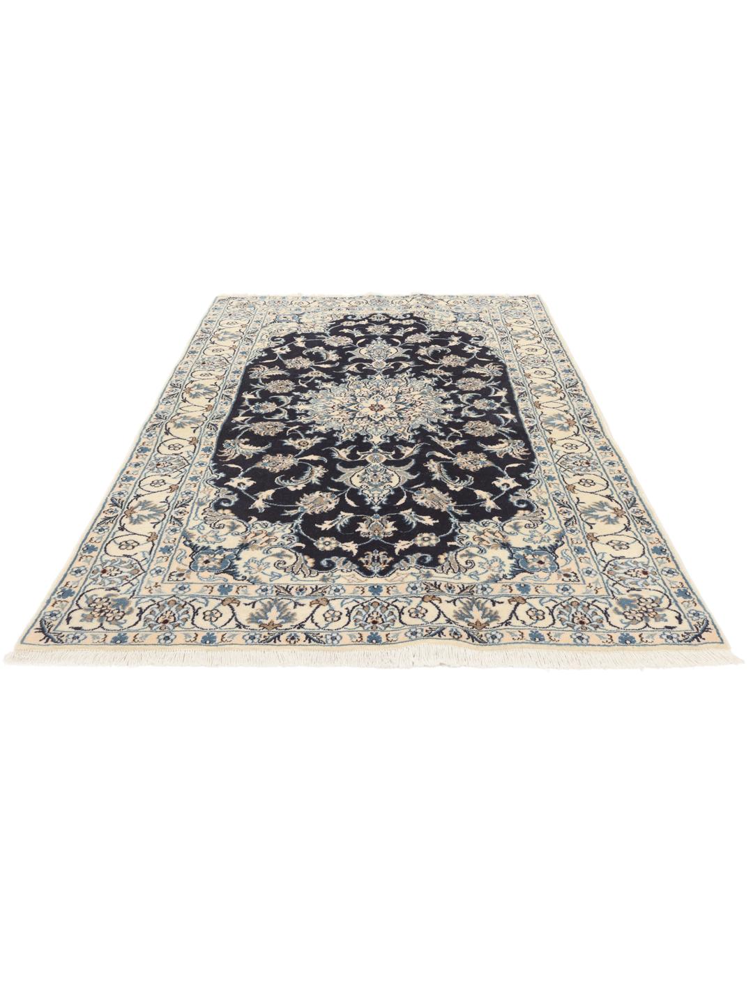 A hand-knotted Nain rug from the Middle East with a navy blue and cream floral medallion design.