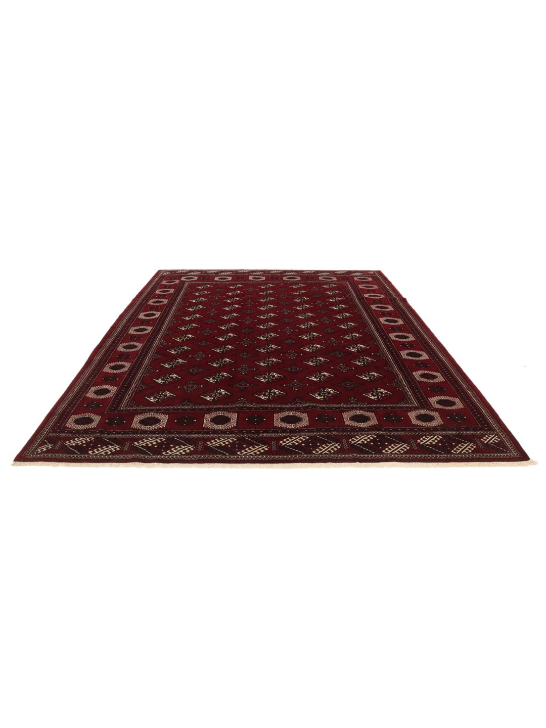 A hand-knotted Turkaman rug from the Middle East in deep red featuring traditional geometric motifs.
