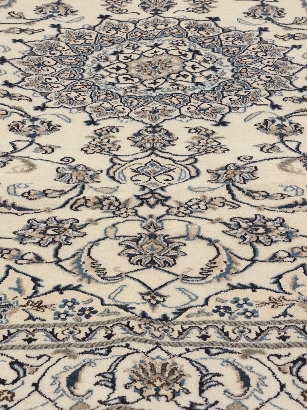Hand-knotted Nain rug from the Middle East in beige and blue tones