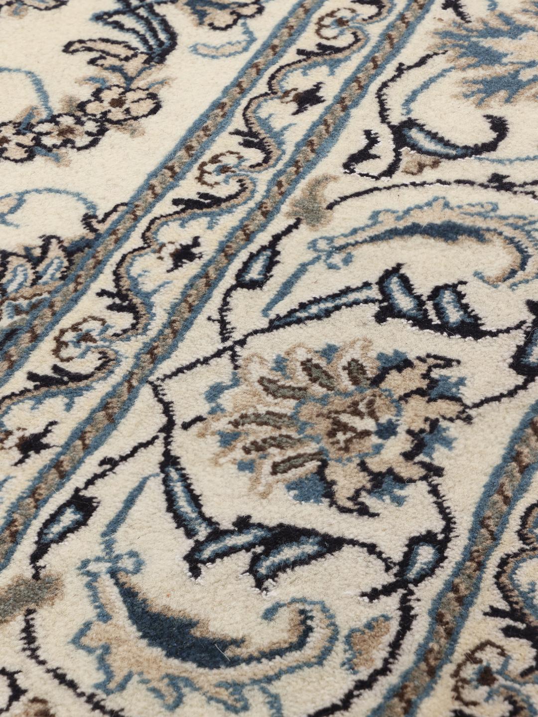 Hand-knotted Nain rug from the Middle East in beige and blue tones