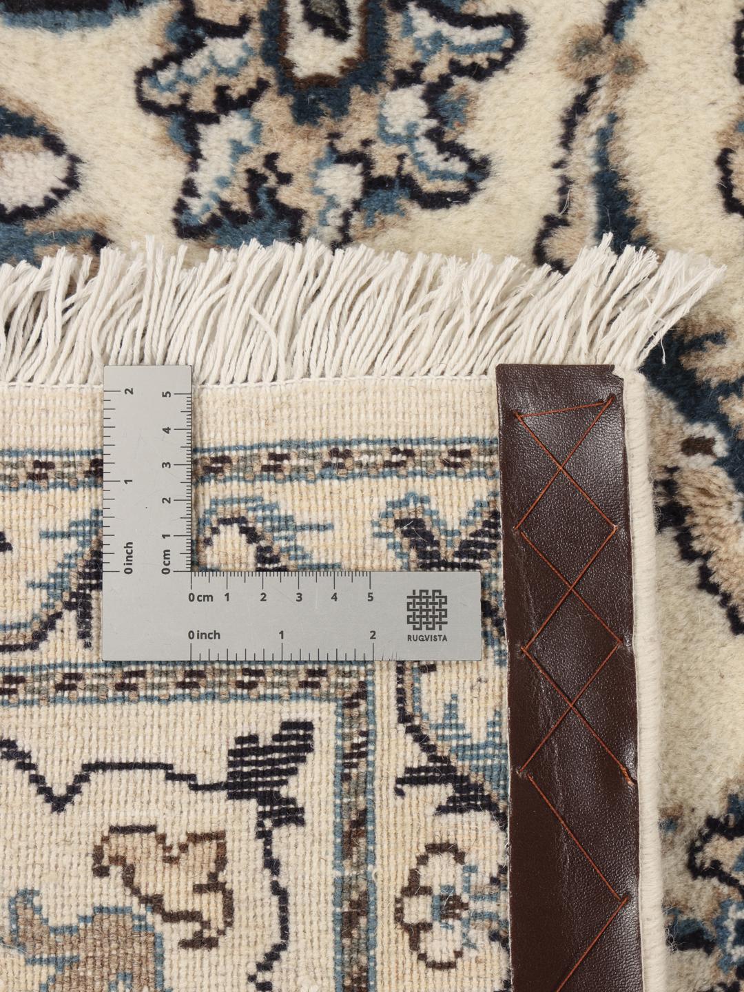 Hand-knotted Nain rug from the Middle East in beige and blue tones