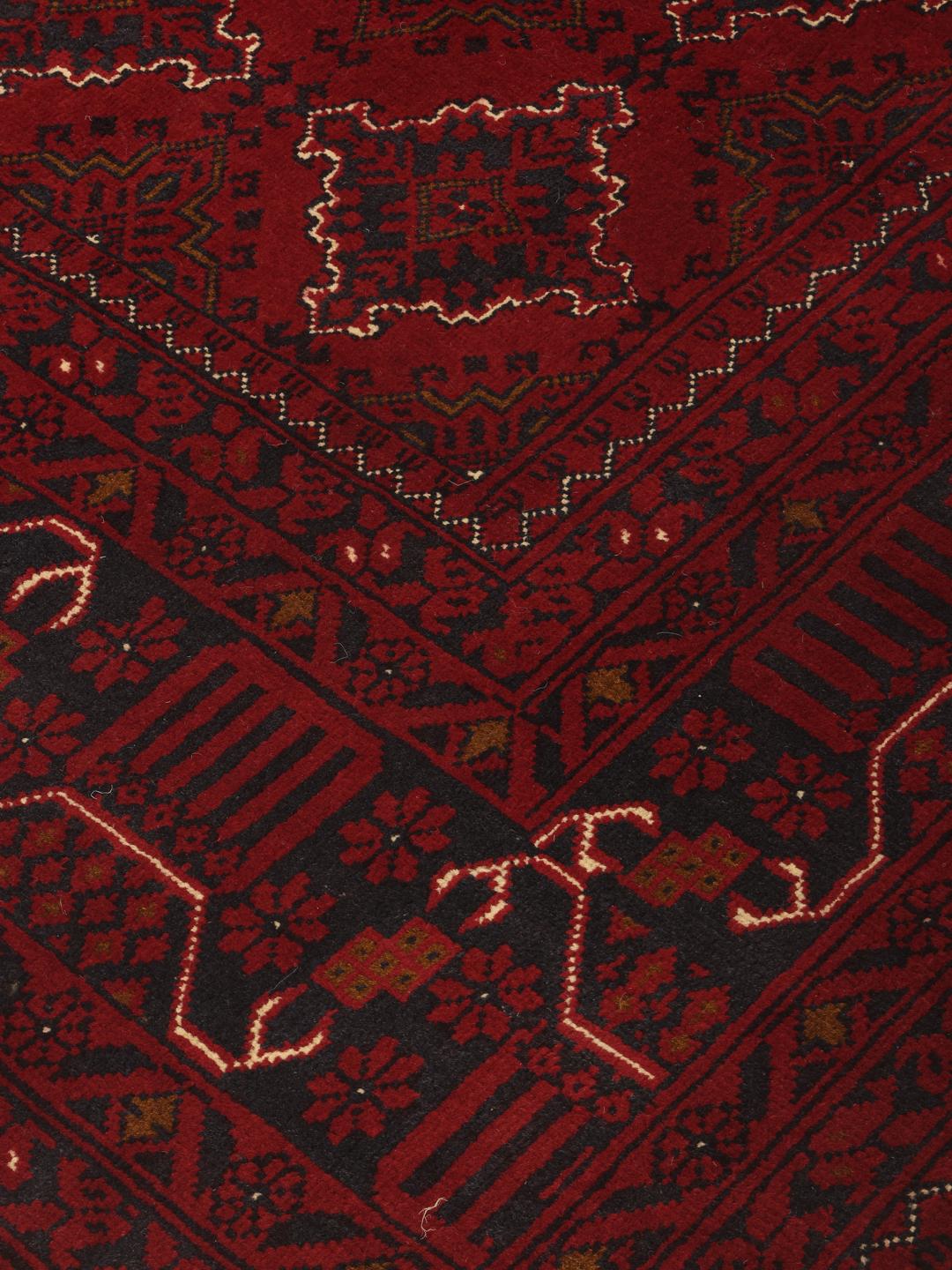 Hand-knotted Kunduz rug from the Middle East in deep red
