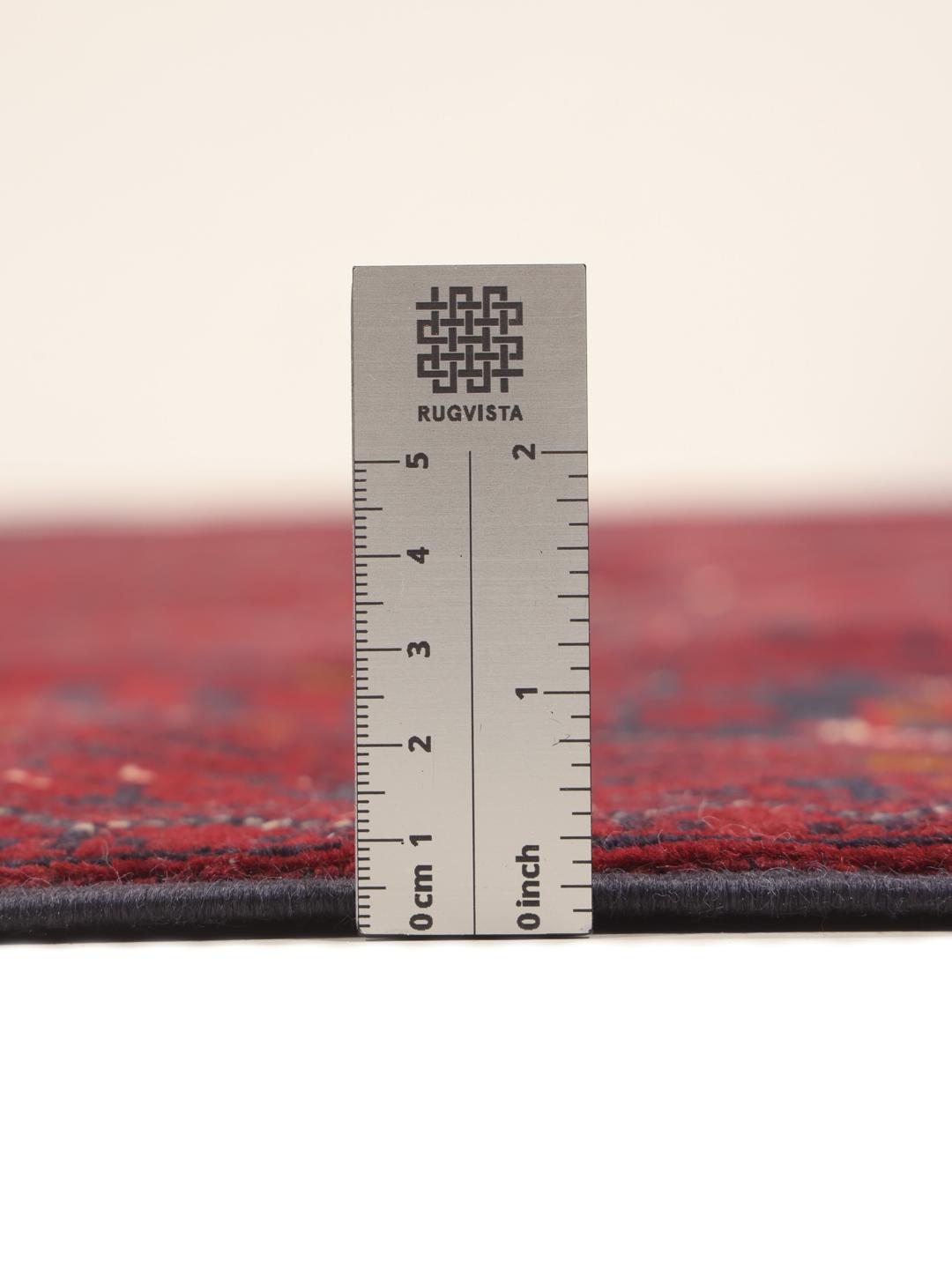 Hand-knotted Kunduz rug from the Middle East in deep red