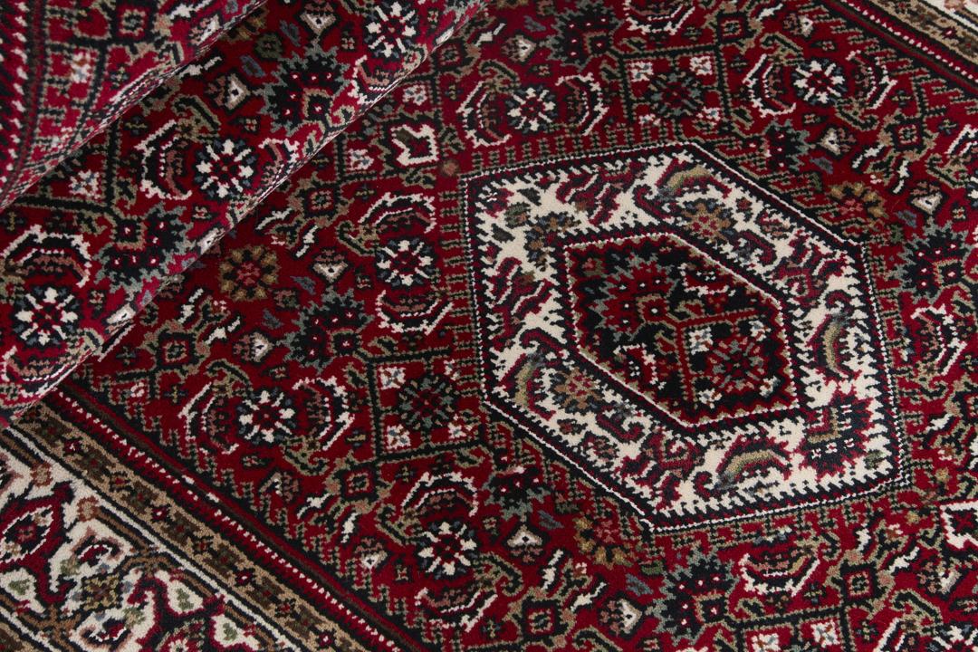 Handgeknoopt Bidjar Indo loper tapijt in rood met traditionele motieven uit India