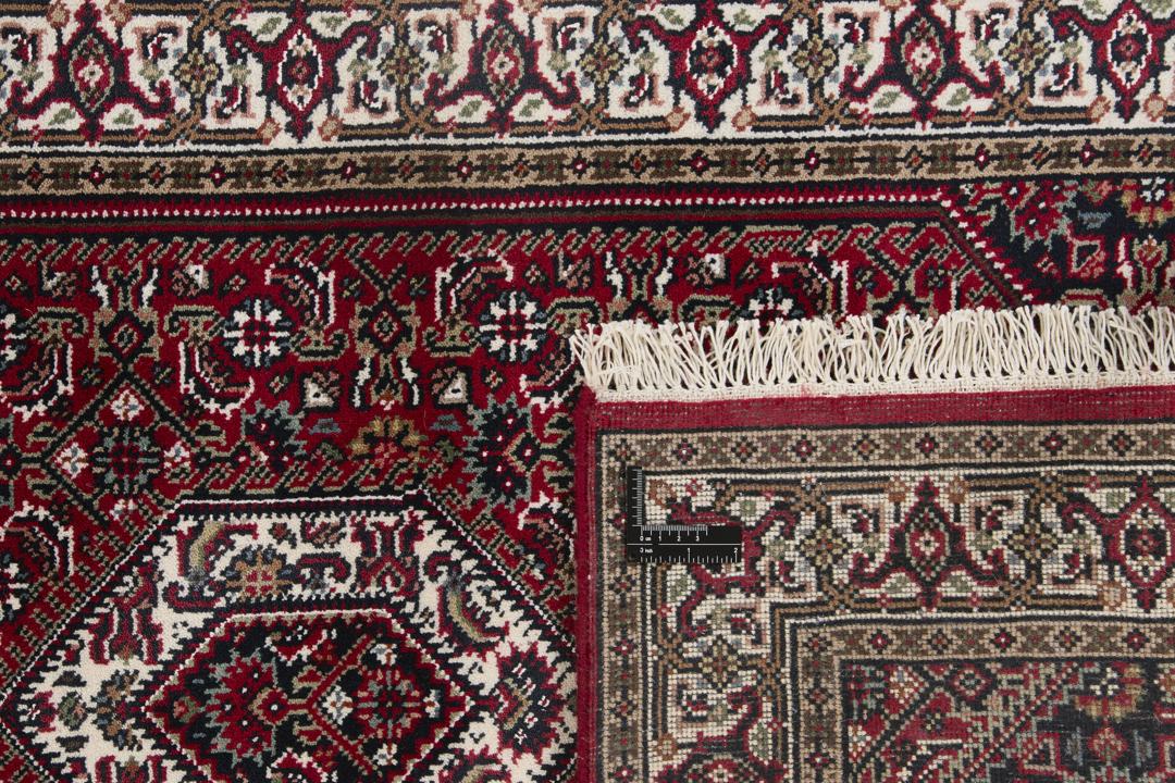 Handgeknoopt Bidjar Indo loper tapijt in rood met traditionele motieven uit India