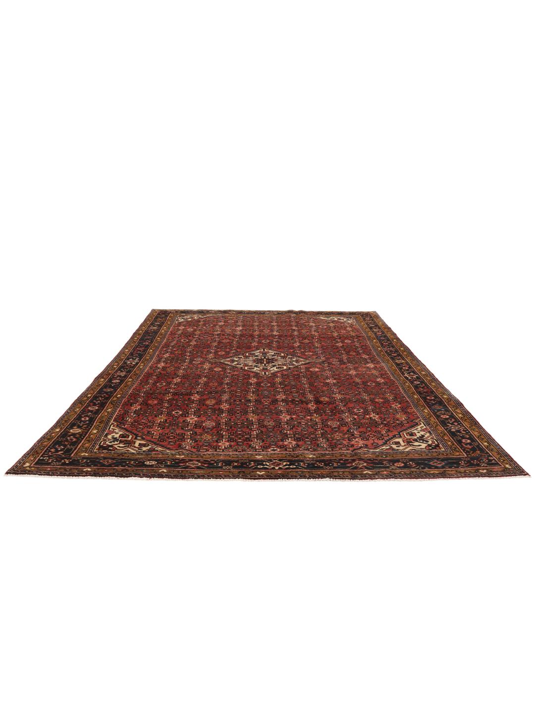 Hand-knotted Hosseinabad Wool rug from the Middle East in deep red