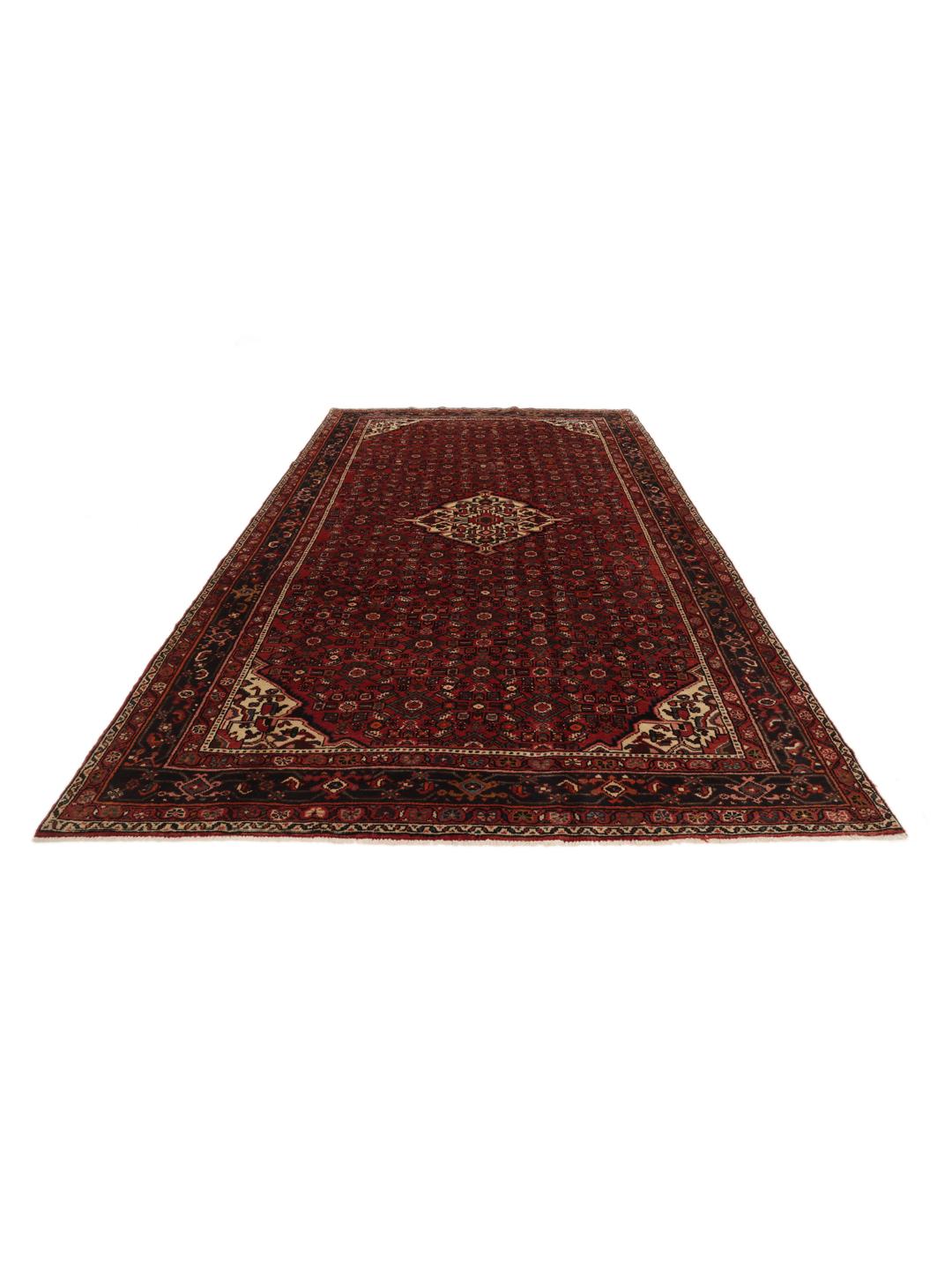 Hand-knotted Hosseinabad rug from the Middle East in deep red and dark blue tones.