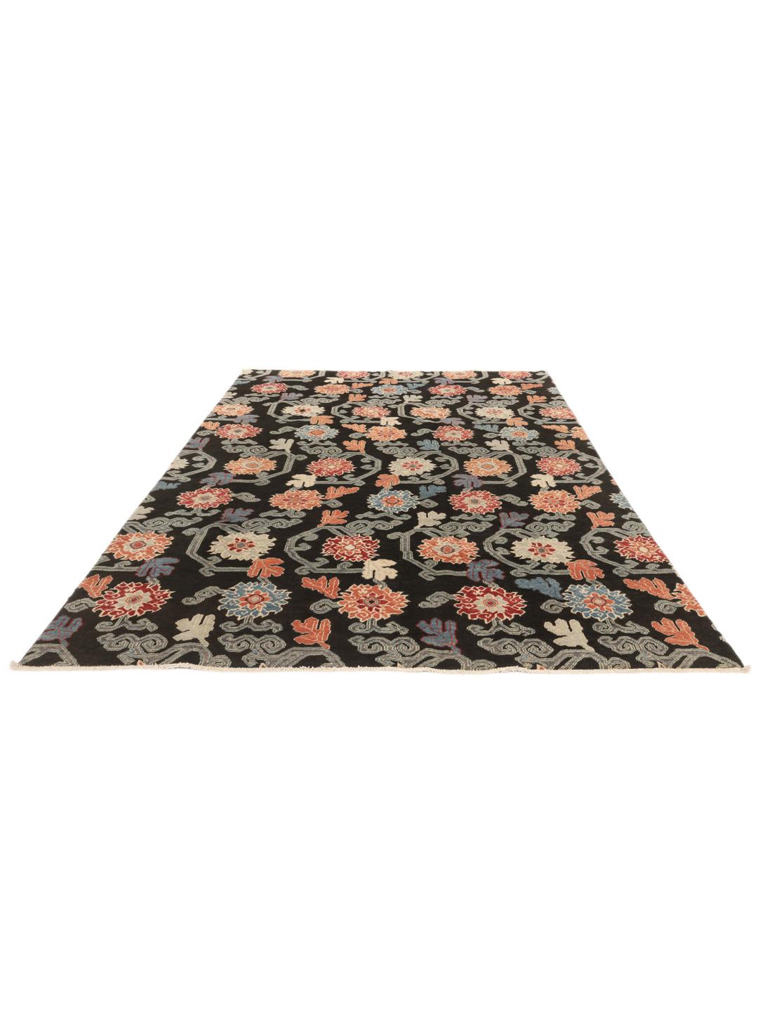 Hand-knotted Afghan Kazak rug with floral patterns on a black field