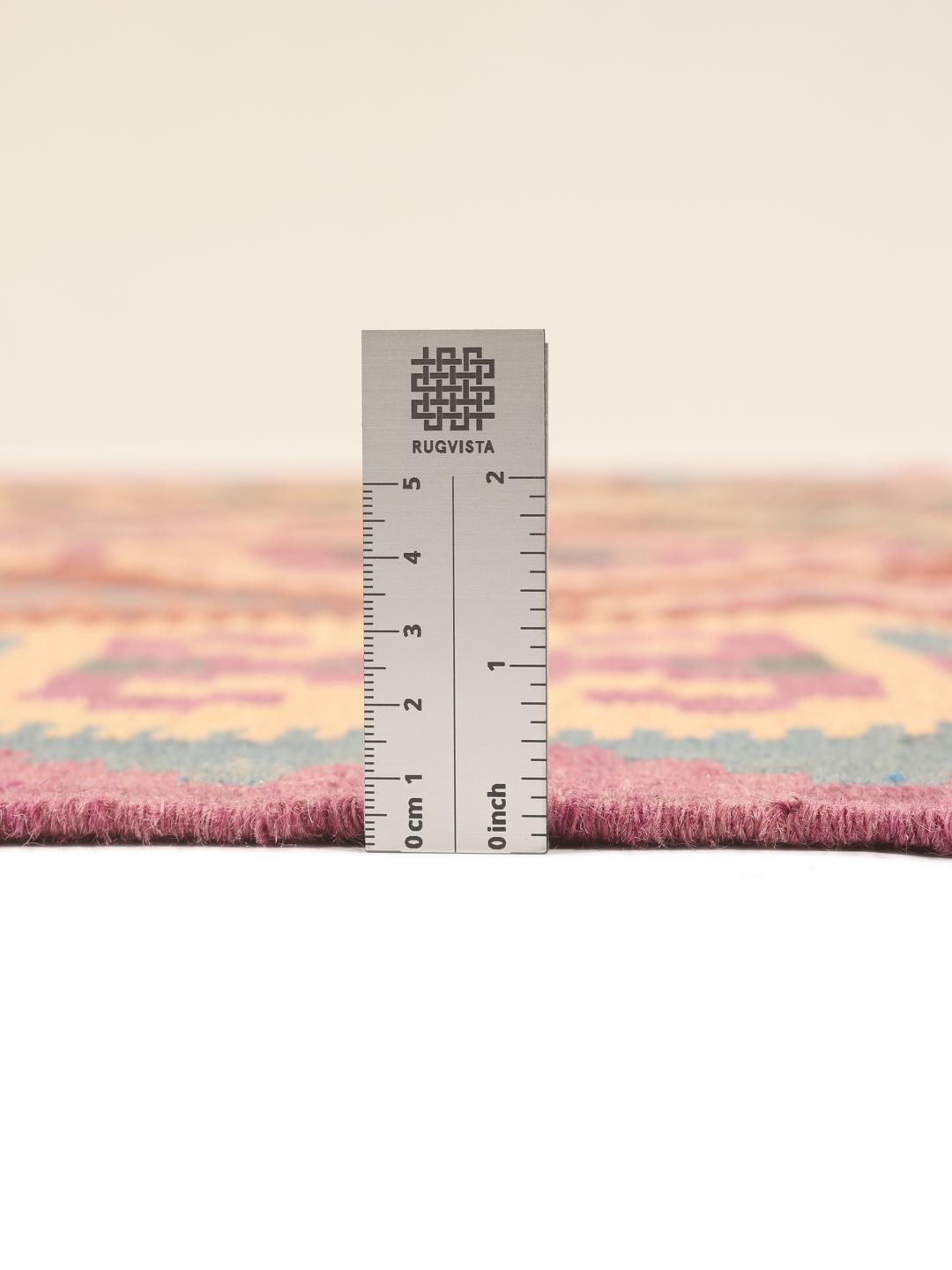 A hand-woven multicolor Kelim Ghashghai rug with geometric diamond patterns.