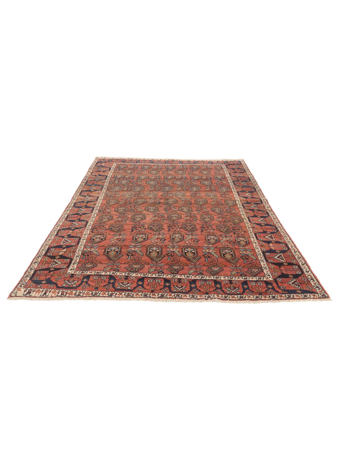 Handgeknoopt vintage tapijt uit het Midden-Oosten met een rijke rode basis en gedetailleerde motieven.
