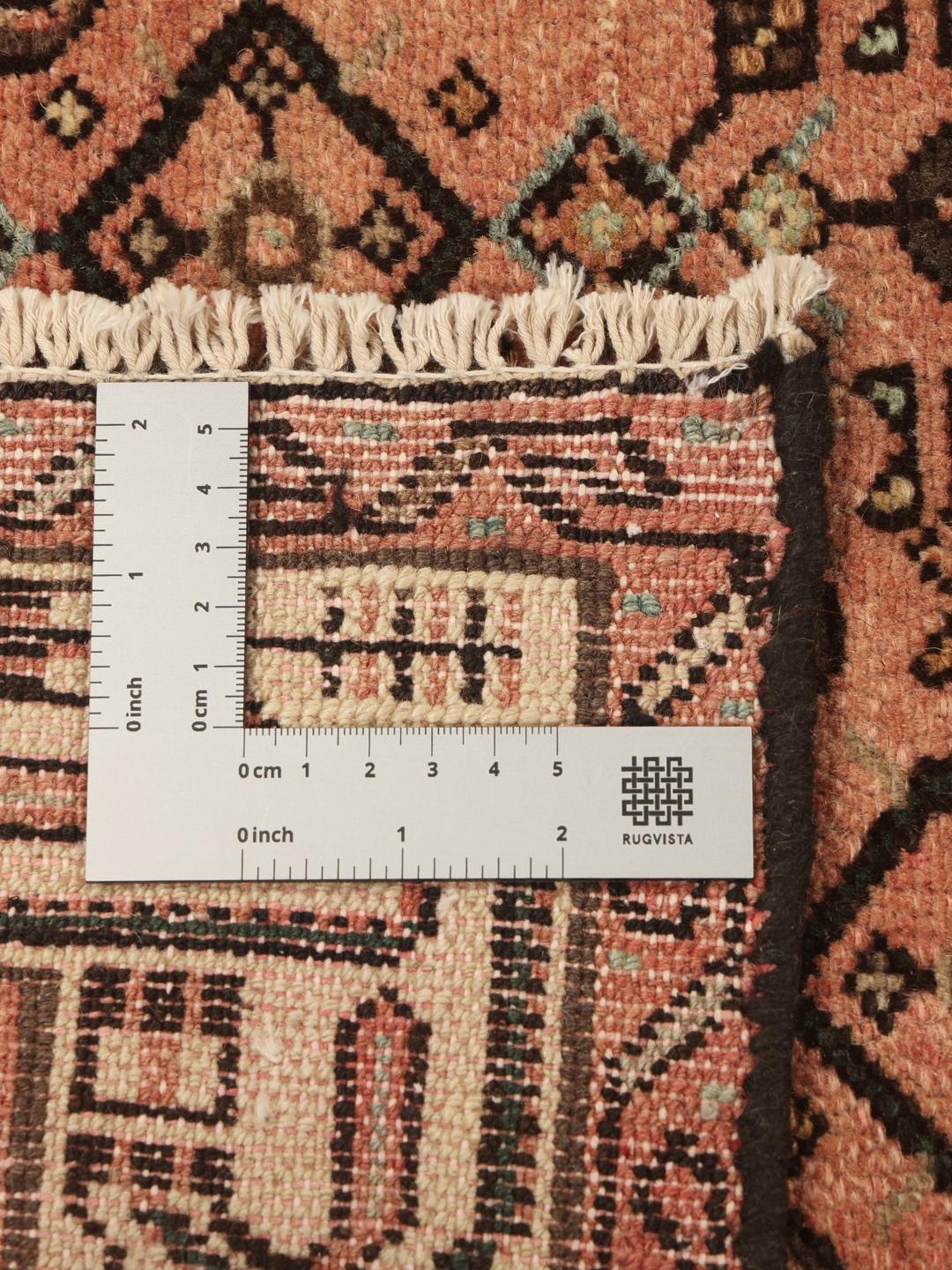 Handgeknoopte vintage loper uit het Midden-Oosten in roodtinten