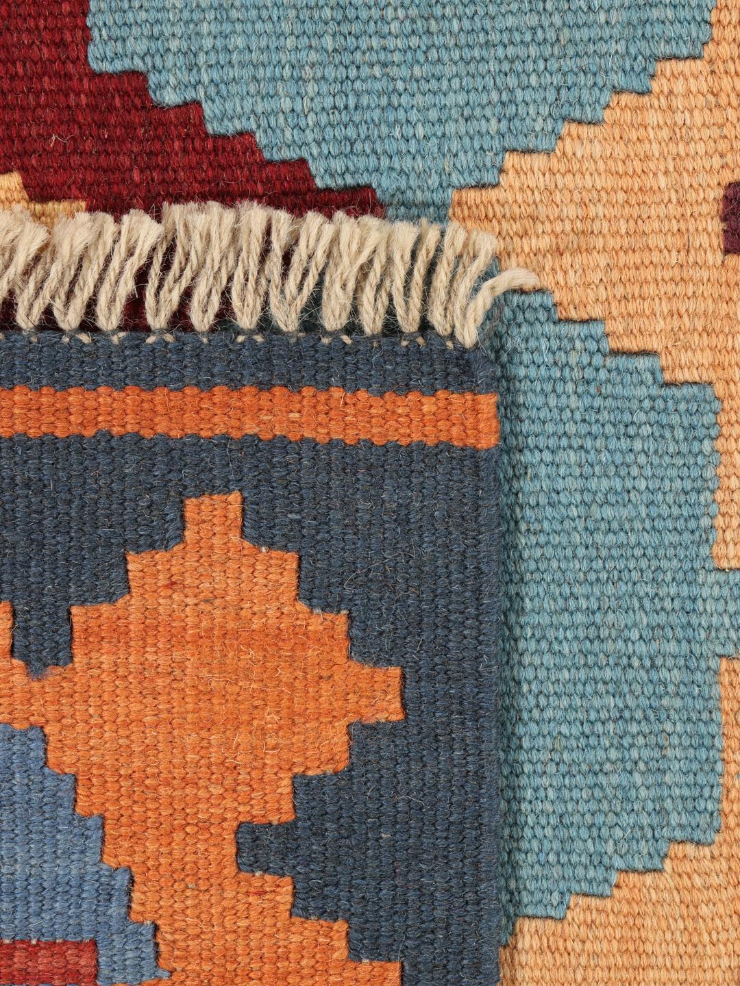 Handgeweven veelkleurig kelim-kleed uit het Midden-Oosten met geometrische motieven