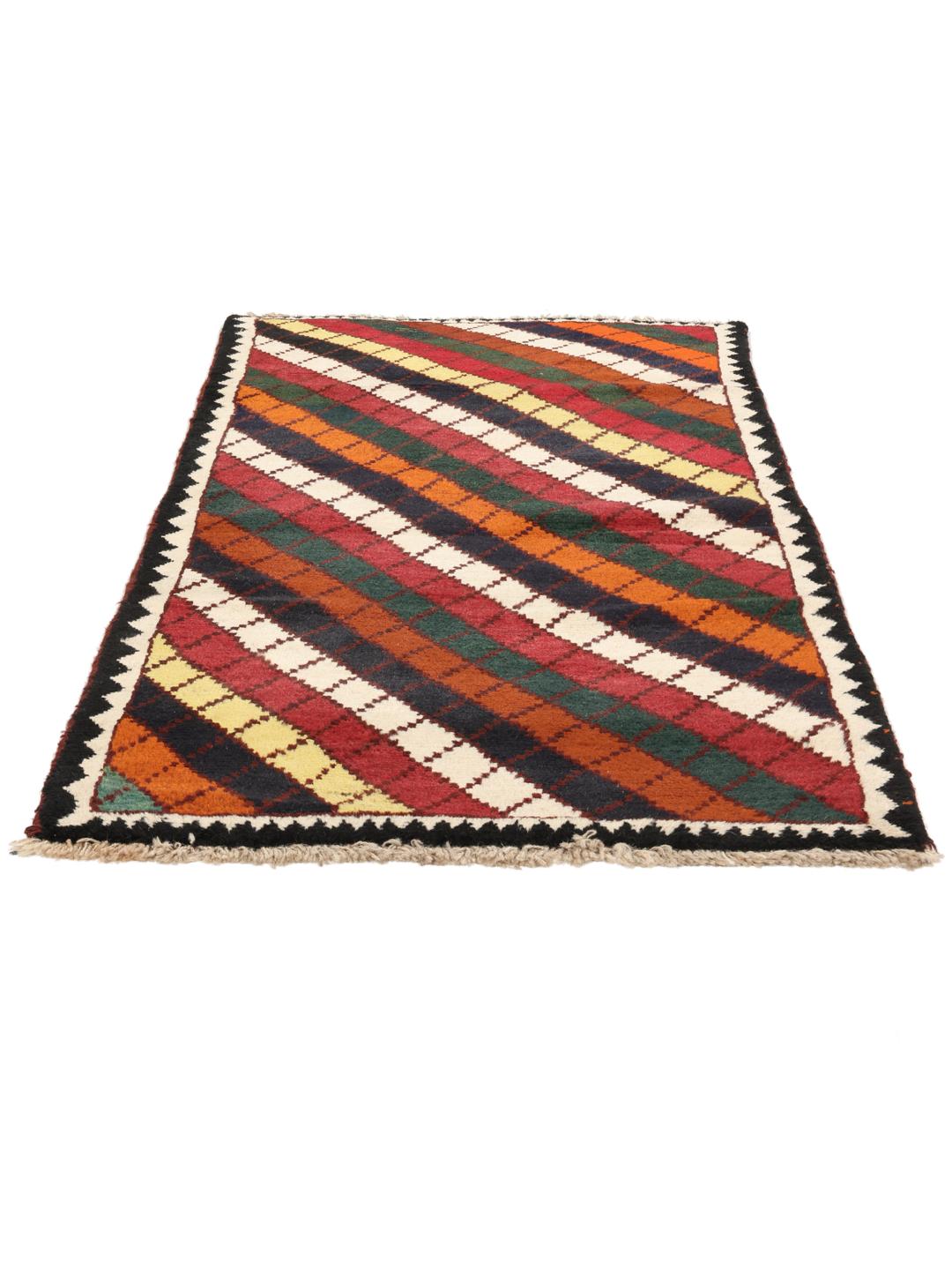 A vibrant, multicoloured Shiraz rug with a bold diagonal pattern and a decorative border.