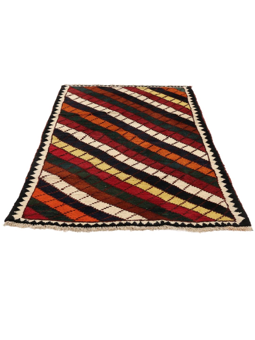 A vibrant, multicoloured Shiraz rug with a bold diagonal pattern and a decorative border.