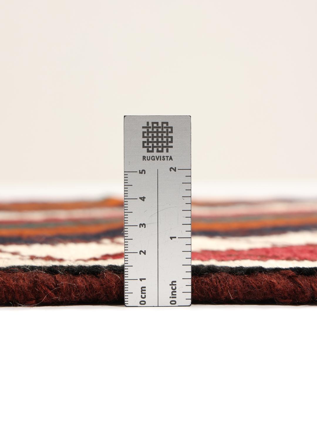 A vibrant, multicoloured Shiraz rug with a bold diagonal pattern and a decorative border.