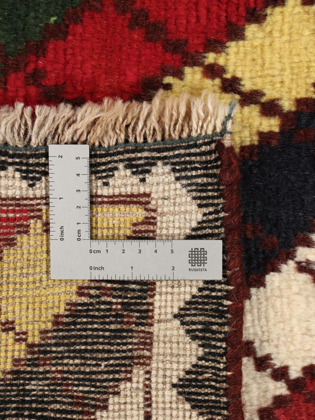 A vibrant, multicoloured Shiraz rug with a bold diagonal pattern and a decorative border.