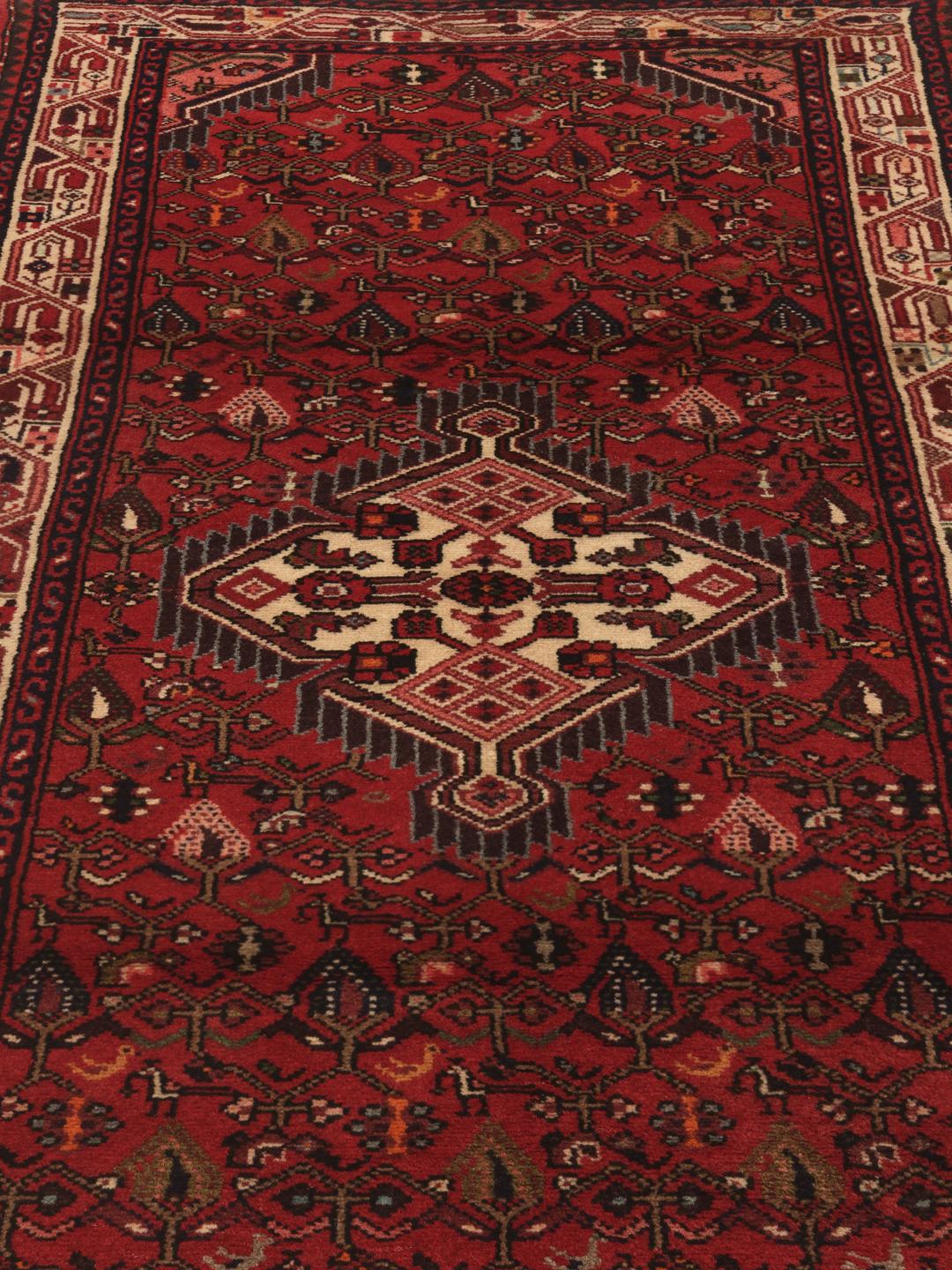 Hand-knotted Asadabad runner in red from the Middle East