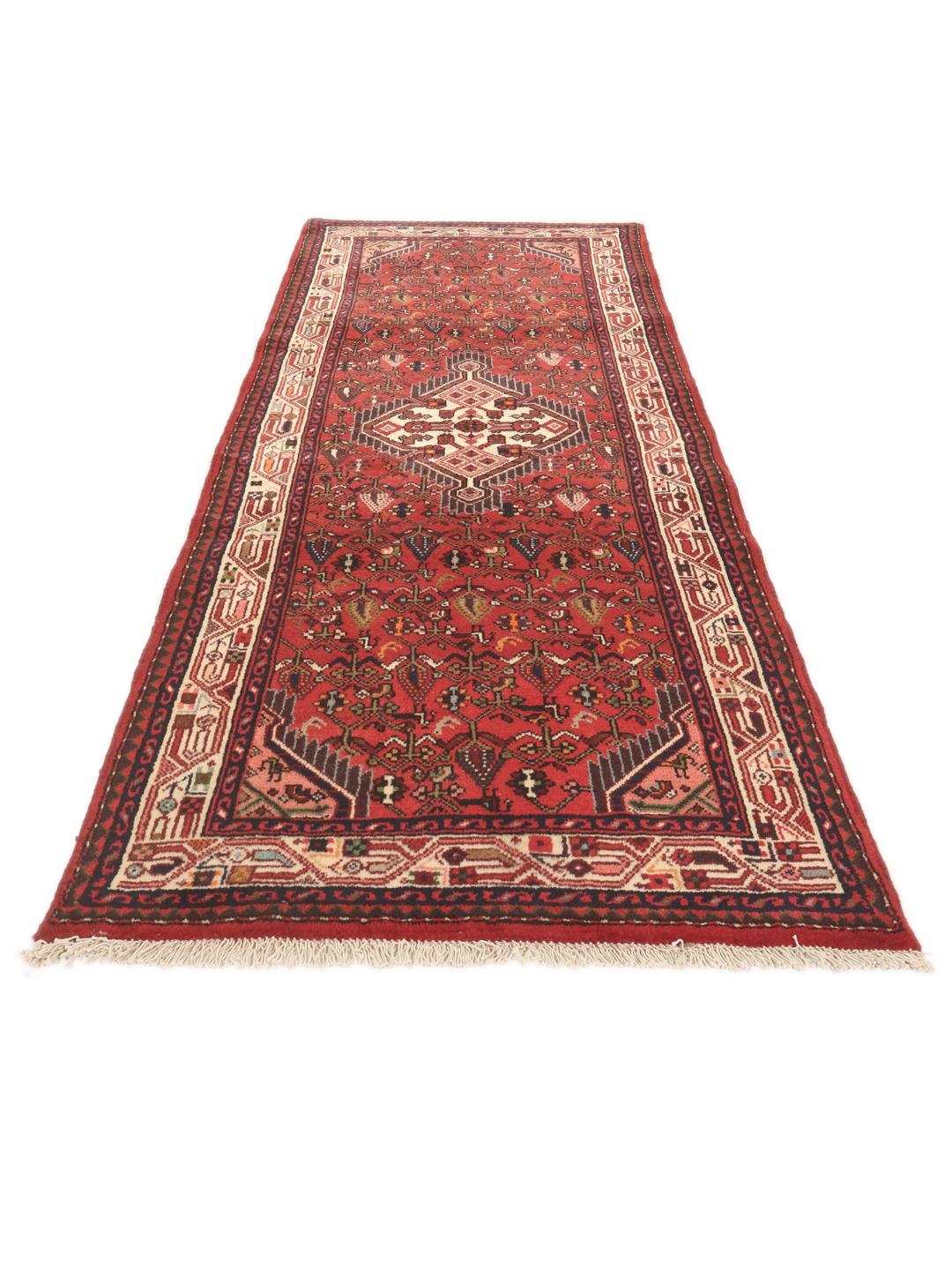 Hand-knotted Asadabad runner in red from the Middle East