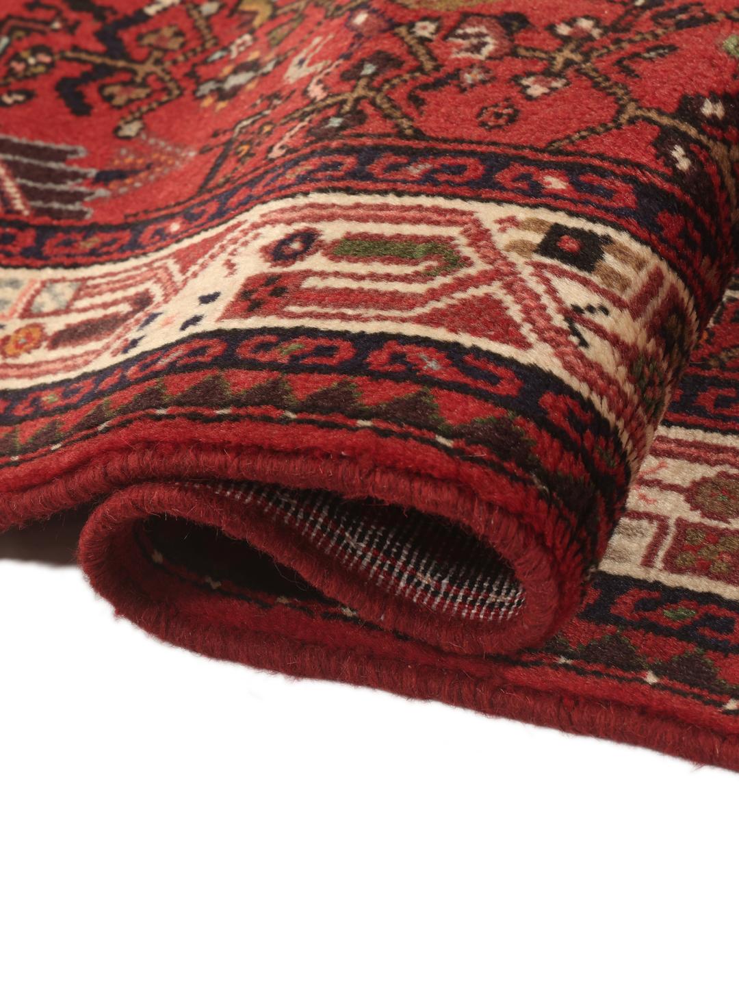 Hand-knotted Asadabad runner in red from the Middle East