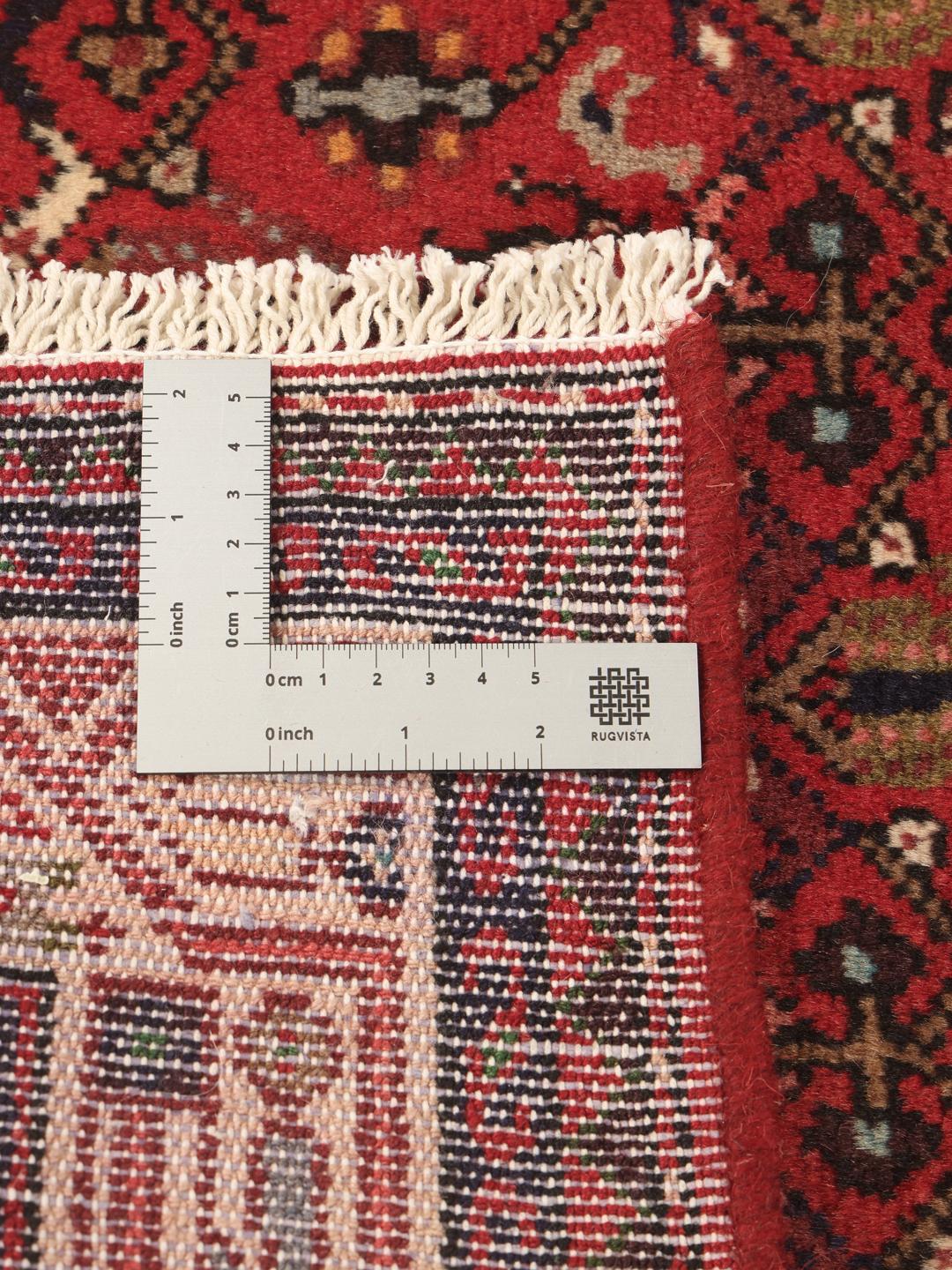 Hand-knotted Asadabad runner in red from the Middle East