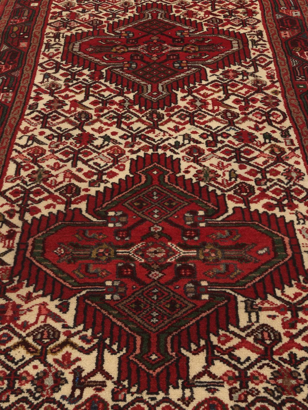 Hand-knotted Asadabad runner with geometric red and cream patterns