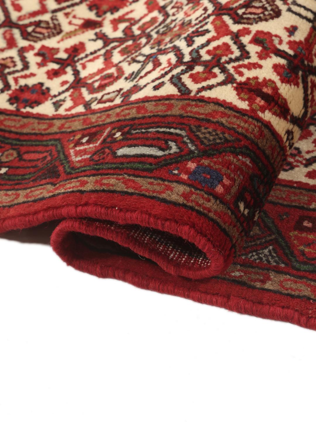 Hand-knotted Asadabad runner with geometric red and cream patterns