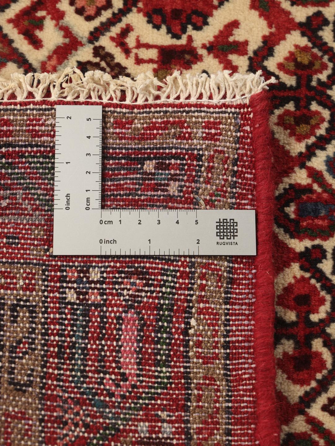 Hand-knotted Asadabad runner with geometric red and cream patterns