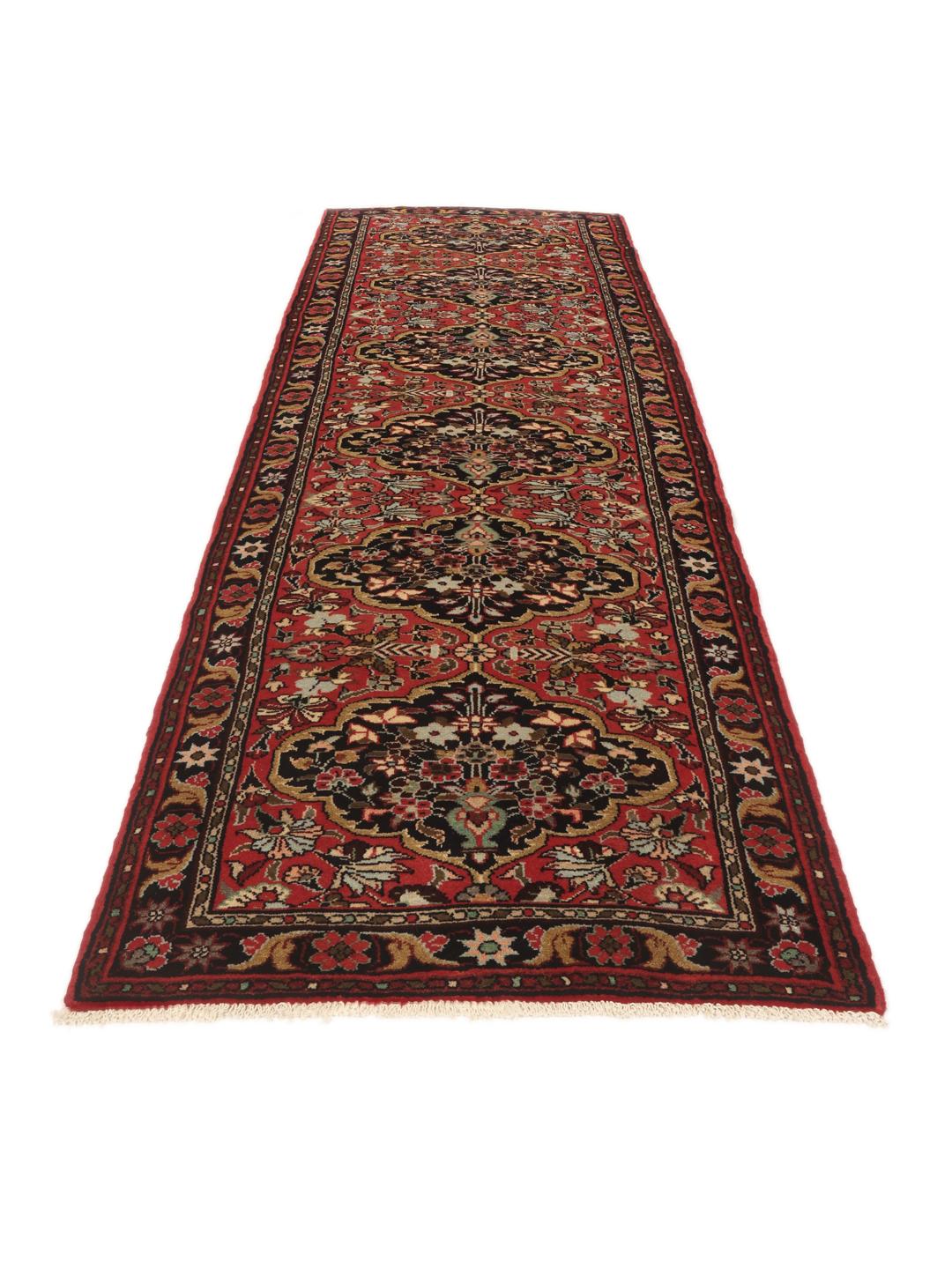 Tapis couloir Mehraban noué à la main dans des tons rouges et sombres avec des motifs floraux