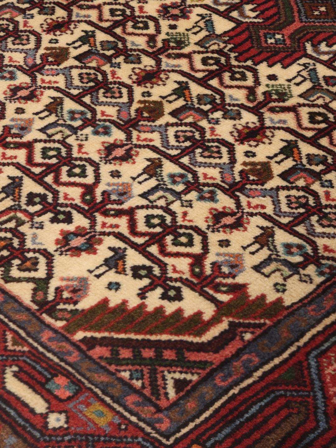 Hand-knotted Asadabad runner from the Middle East in shades of red and beige