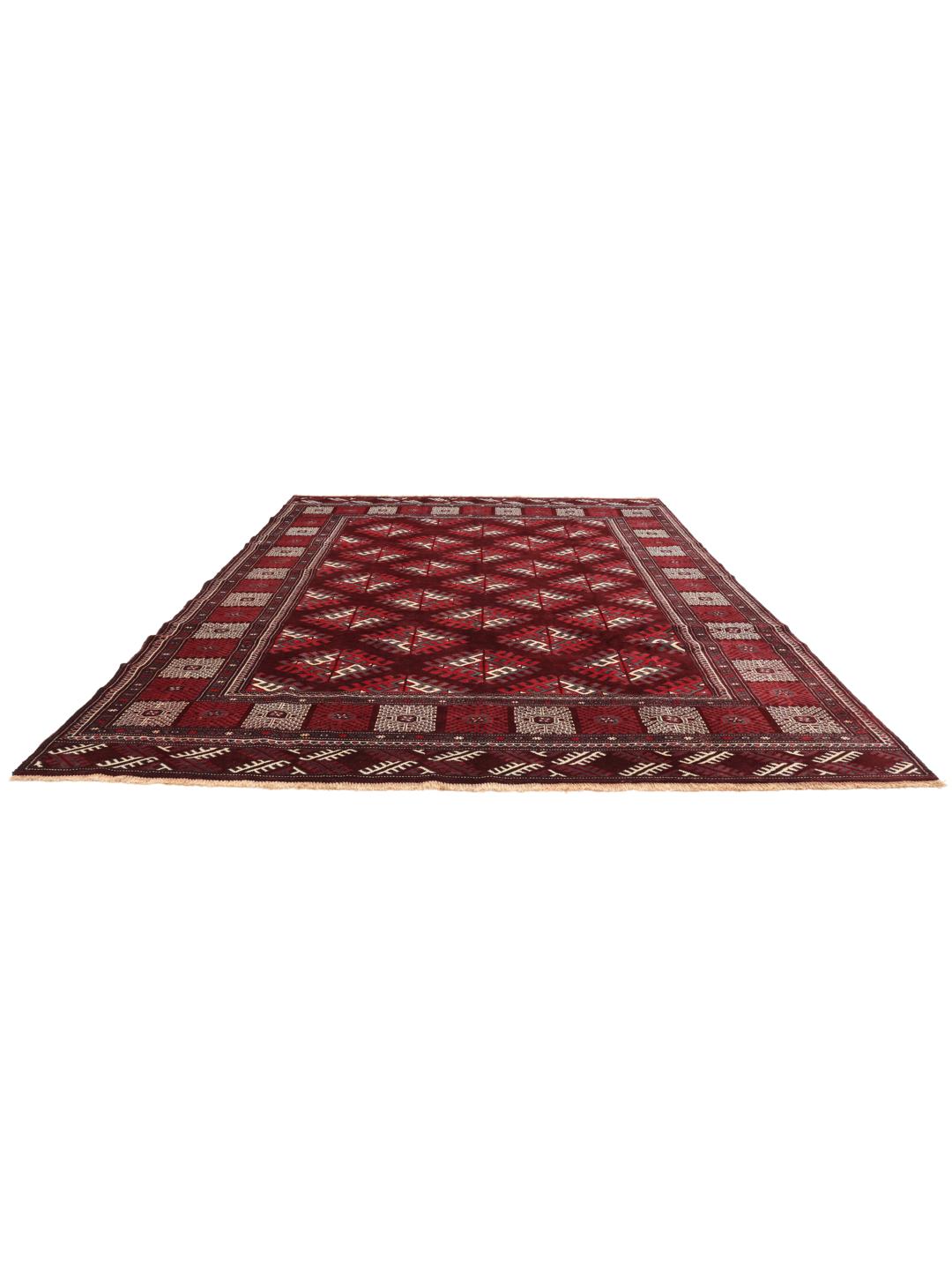A hand-knotted Turkaman rug from the Middle East in shades of dark-red.