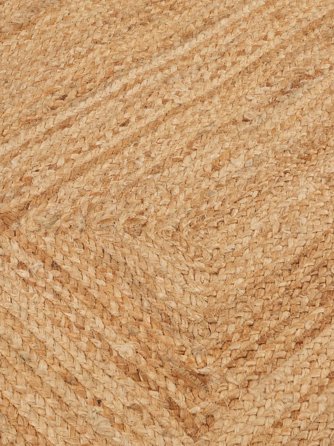 Beige vloerkleed met een golvende rand