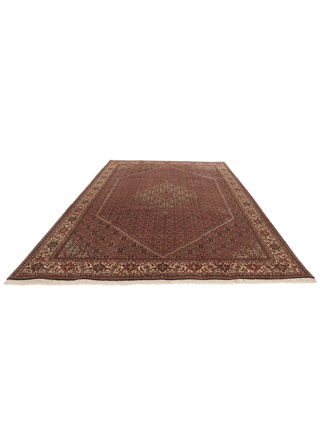 A hand-knotted Bidjar rug from the Middle East with a dark-red field and intricate medallion pattern.