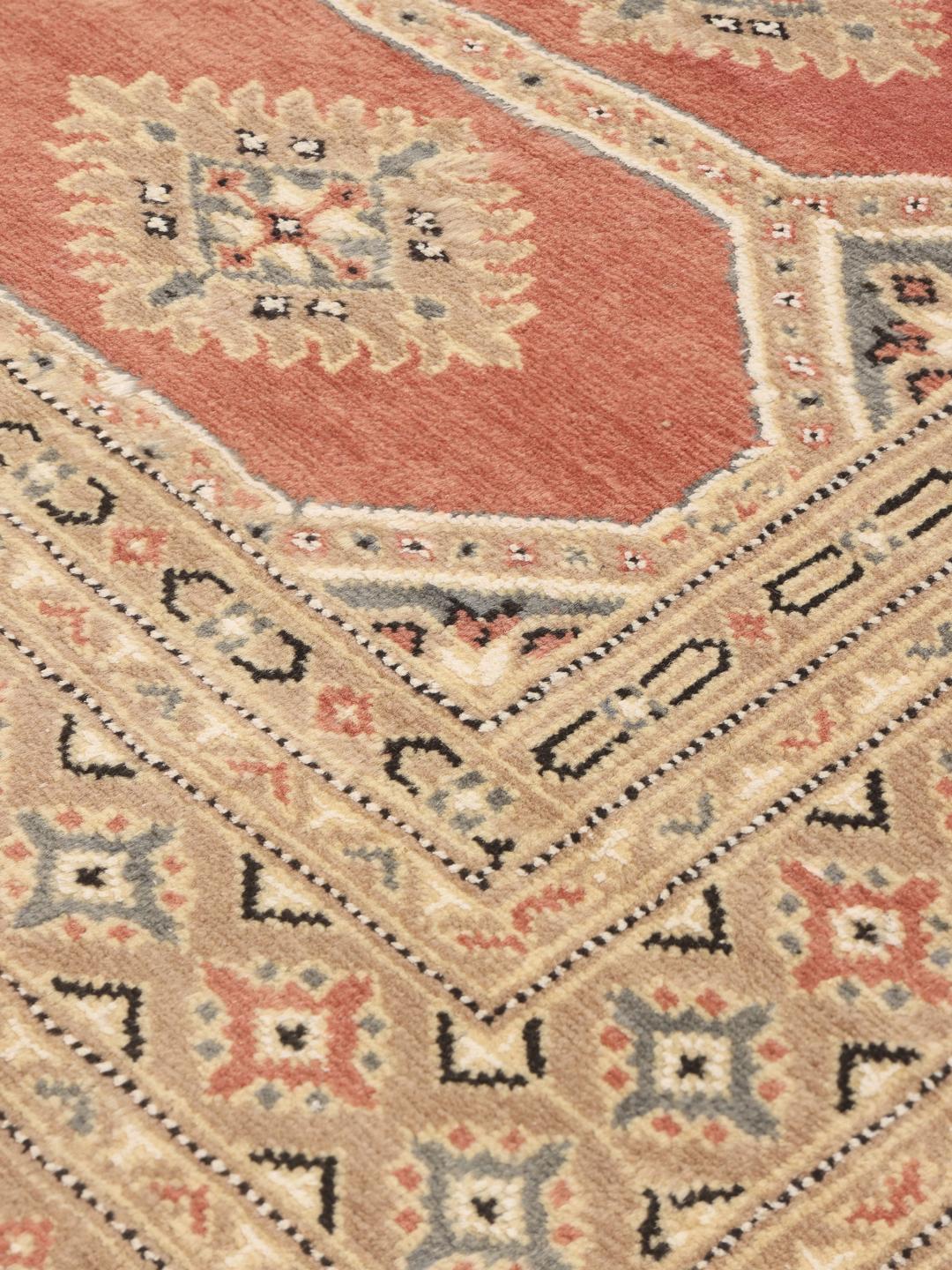 Hand-knotted Pakistan Bokhara 2ply rug in red with detailed tribal motifs