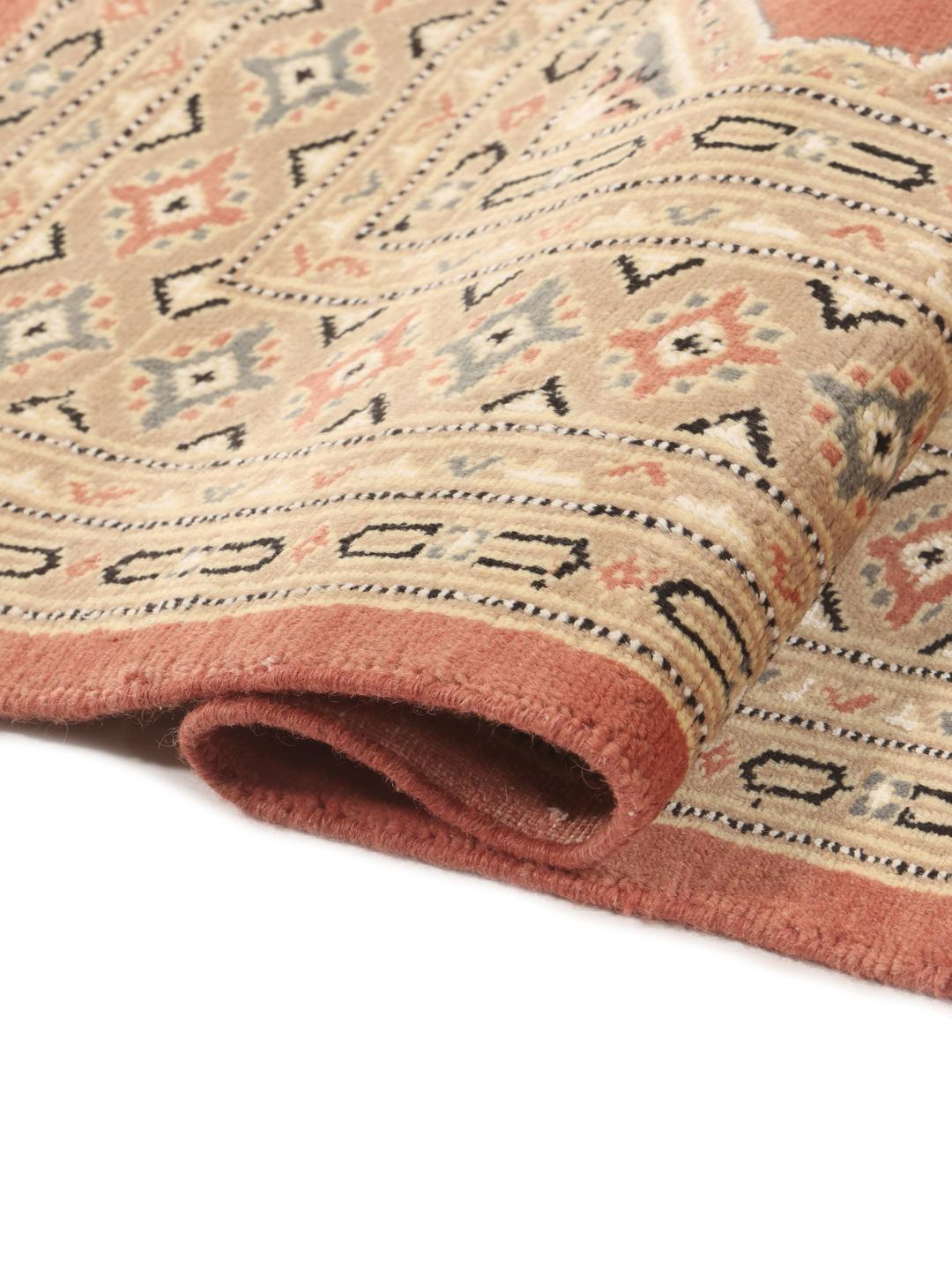 Hand-knotted Pakistan Bokhara 2ply rug in red with detailed tribal motifs