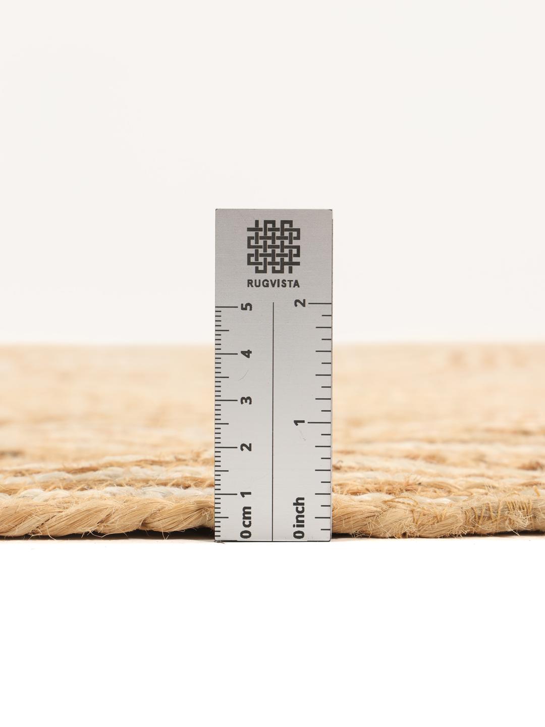 Rond beige vloerkleed met cirkelvormig patroon