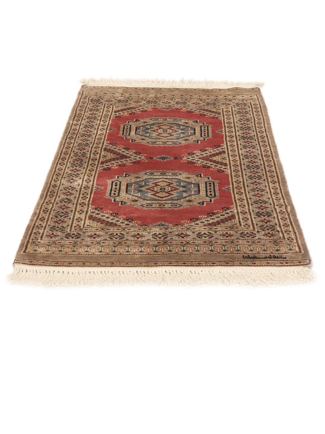 Hand-knotted Pakistan Bokhara rug with a red field and traditional medallion patterns.